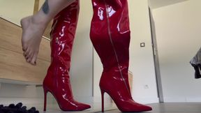 Little brunette in a dominated outfit with long red thigh-high boots
