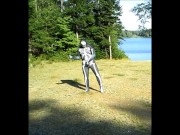 armed zentai skeleton outdoors in the sun