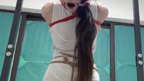 Chinese girl wearing red over-the-knee boots, single gloves, super tight straight arms, hanging up, bound with metal double-mouth ring clip, drooling and raising her head