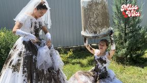 Two brides in mud and ripping wedding dresses! Smoking!