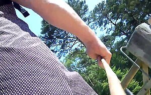 Crossdresser walking with butt plug in the forest