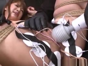 Pretty Asian restrained with rope has sex toys inserted for helpless orgasm