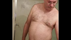 Nude Martin Lavall&eacute_e installs his transparent cock cage over his small penis and compares it with his 10 inch dildo