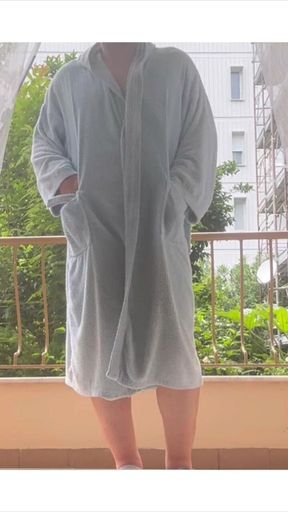 On the terrace in a bathrobe