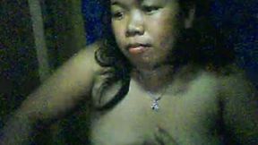 Chubby Filipina bitch shows her boobs and fingers her shaved pussy