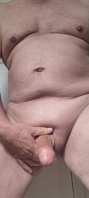 Solosexual strokes my shaved, oiled up cock to get a load of cum to swallow