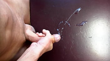 Twink wanking and jerking off a huge cumload on a desk