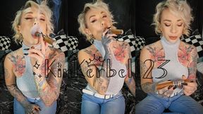 Smoking and inhaling cigar in Denim jeans and Silver top - Kinkerbell23