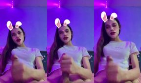 Cute Asian Ladyboy jerks off her tight hand until thick cum gushes everywhere