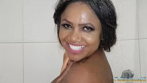 Her dark skin glows under the shower&#x1F6BF;'s steam