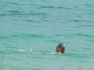 Watching on the beach as Isa has pleasure