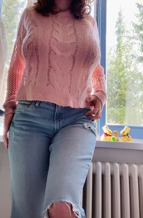 Blonde woman in pink sweater