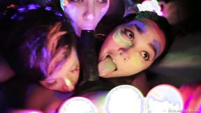 Sexy lesbian girls playing with fluorescent body paint