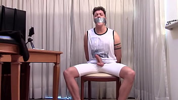 Adonis the first time gagged in bondage in lycra shorts moaning and teasing hard cock