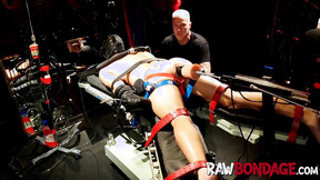 Chained jock Devin Franco lying face down being fisted in his booty