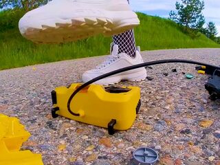 Large excavator is destroyed kicked, trampled, crushed, smashed, crushed, broken plastic car, crush