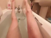 Skinny guy shows off his skinny legs in bathtub and scrubs his cock