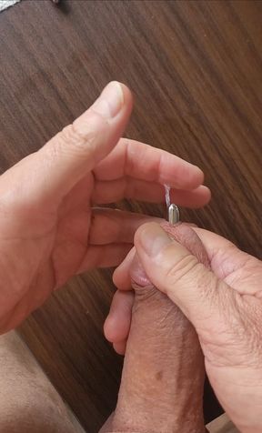 Masturbating with sounding rod in my cock