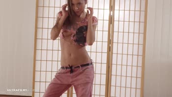 Lily Chey Sizzles in Seductive Solo Stripdown
