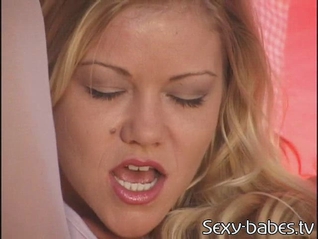 Seductive Julie Meadows relaxes in bed with just her wet pussy for companionship