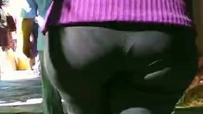 Hot chick shows off her wide hips in tight trousers