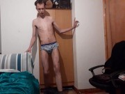 Anorexic teen works out with dumbbells and stretches out his skinny sexy body