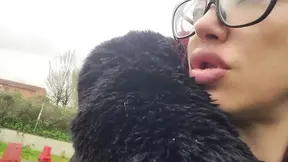 Gorgeous woman with big lips burps on her man in a park