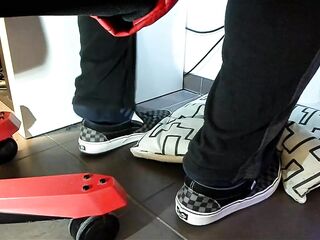 Male shoeplay and stomping stuff at home in Nikes, Vans, blue stiped socks
