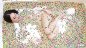 ”Big Titted Brunette Maddy May Rubs Her Clit & Drills Herself with a Pink Dildo Solo”