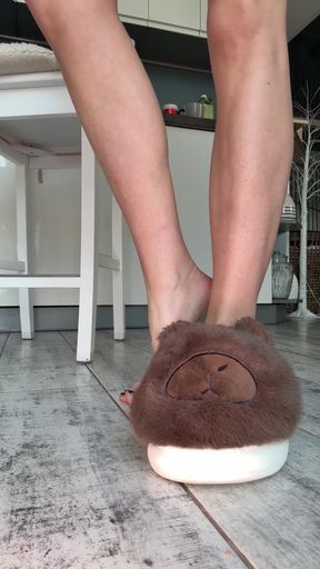 Fuzzy slippers on feet