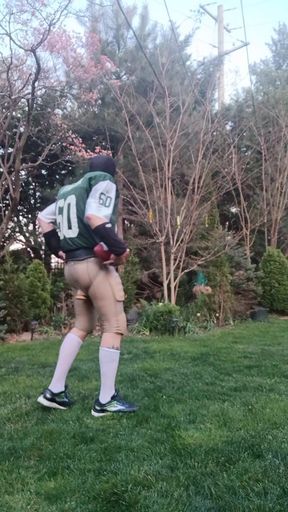 Football jock working out, plugged