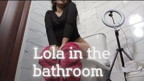 Lola in the bathroom with a stomach ache