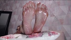 Big Feet covered with baby oil