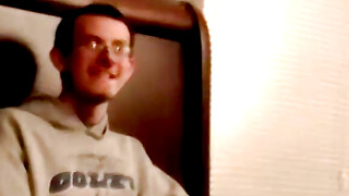 Two amateur freaks jerk off together in a cheap motel room