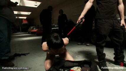 Bound slut fucked in public garage