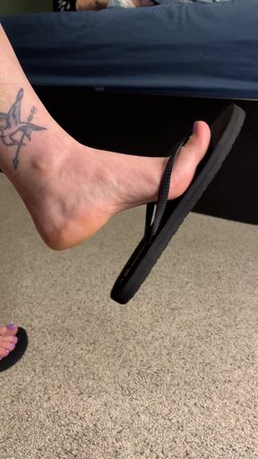 Playful girl shows off her flip flops