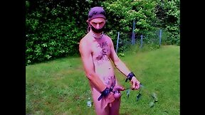 Public outdoor bdsm cbt: slave pig exposed with nettle urethra and dirty body writing