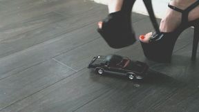 Giantess goddess Charlie Caroline Crushes a 1983 Oldsmobile Hurst in mega black heels with painted toenails close upper right view