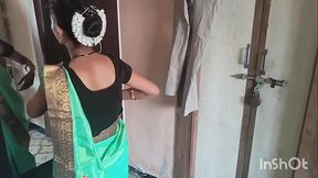 Village bhabhi in green saree getting ready for party.