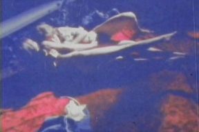 Blue-tinted Vintage Loop Shows Retro Couple in Raw 70s Action