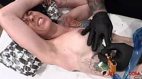 Marie Bossette gets a rose tattooed on her rib
