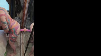 Redhead MILF gets choked by suction dildo on wall