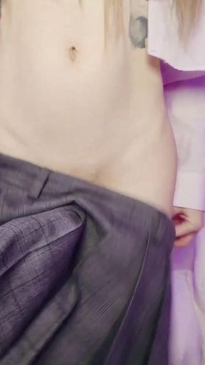 A t-girl's hard cock under a school skirt