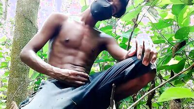 Masked Latino is stroking his huge dong deep inside the jungle