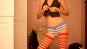 Slim girl stripping in front of a webcam isn't aware I am filming her