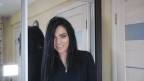 Pretty girl with enchanting eyes walks around the room in high heels