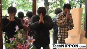 Japanese girl plays with her pussy while some boys peep
