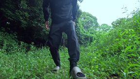 Exposes a big hairless foreskin in the woods.