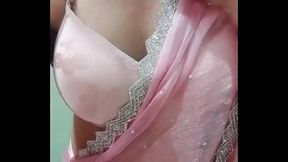 Indian Gay Crossdresser Bottom Gaurisissy Pressing and Playing with Her Big Boobs in Pink Saree with jwellery Looking Like a Housewife