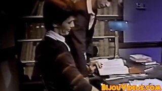 Nerdy college students blow each other in the library